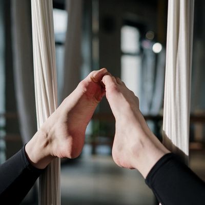 Close-up of hands and feet positions during a yoga practice.